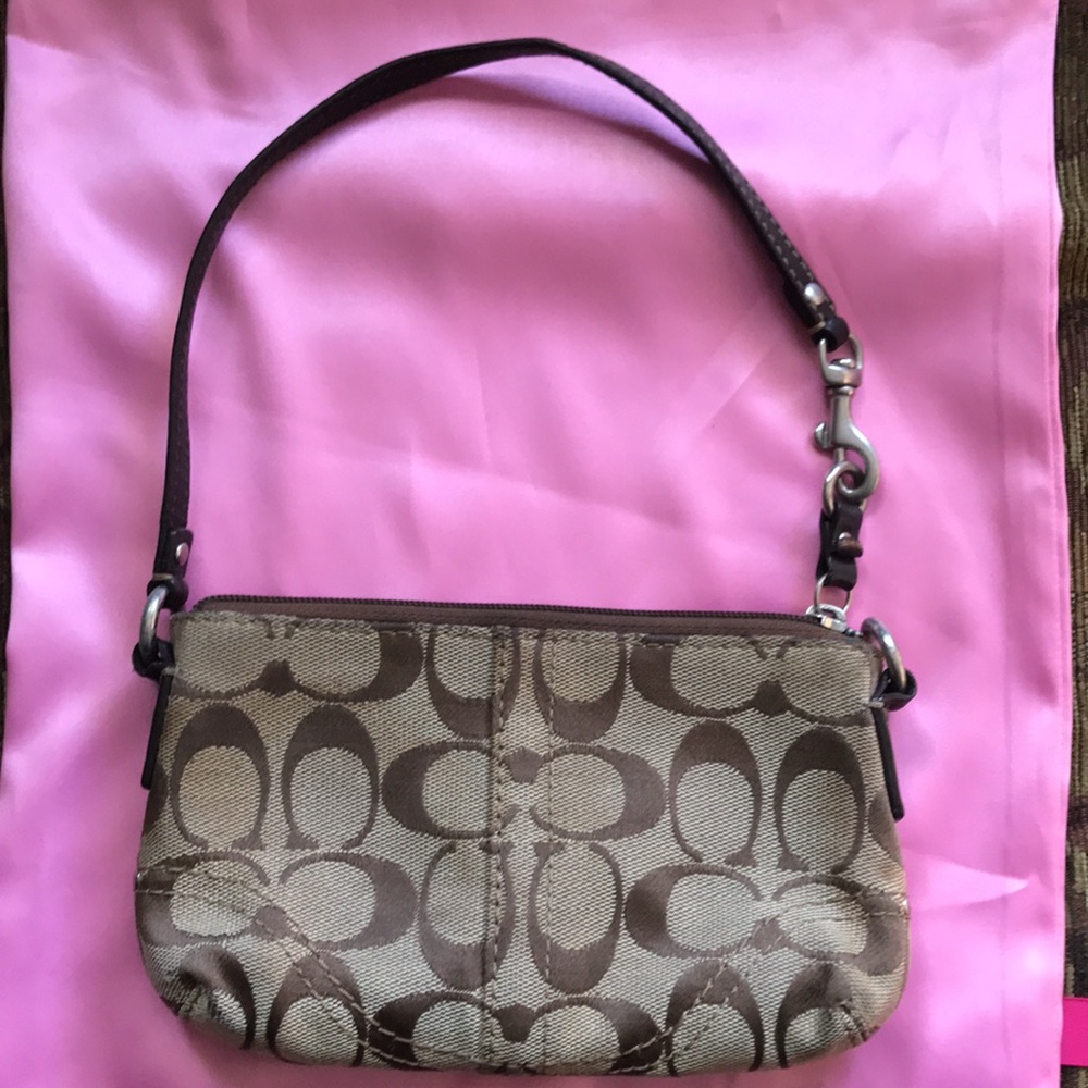 Coach c-canvas/leather handle wristlet.